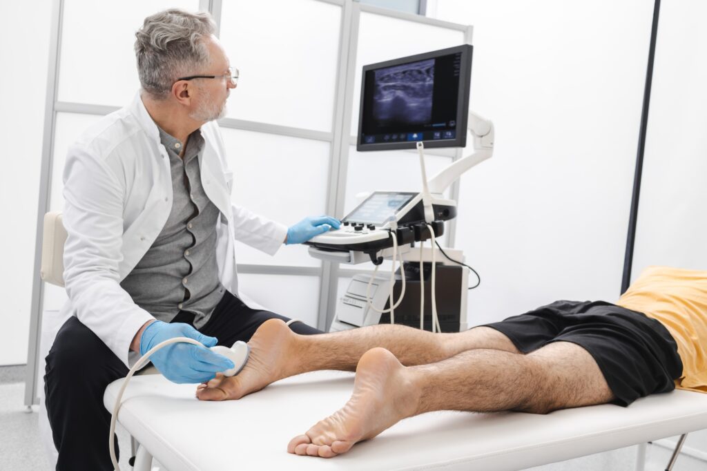 Doctor doing ultrasound in patient