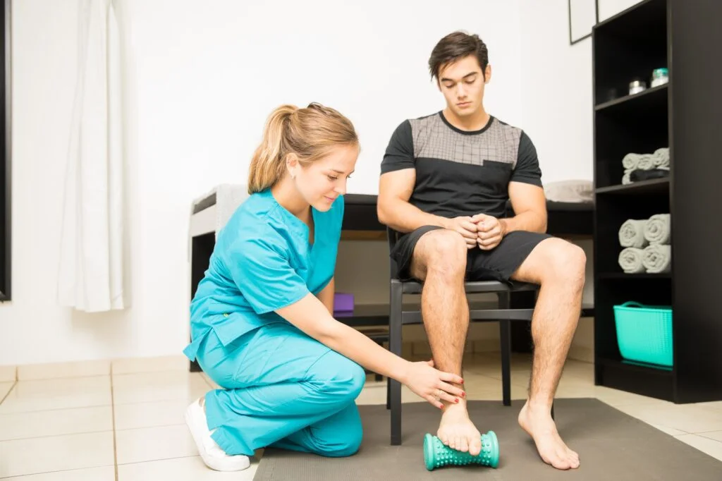 Clinician treating a patient’s foot for plantar fasciitis and heel pain